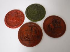Four resin plaques depicting historical figures on horseback