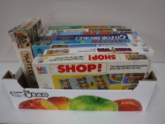 A box containing MB board games, including Frogger, Pacman, Donkey Kong,