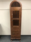 An Oriental style dome top storage cabinet,