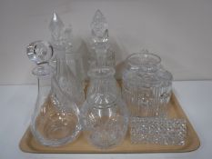 A tray containing lead crystal biscuit barrel, set of six napkin rings,