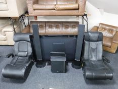 A Samsung 50 inch plasma TV with surround sound speakers