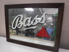 An oak framed Bass in Bottle advertisement mirror