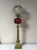 An antique brass Corinthian column oil lamp with chimney and shade CONDITION REPORT: