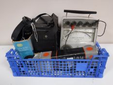 A crate containing a Bakelite cased Avometer, a Select Test Super 50 meter,