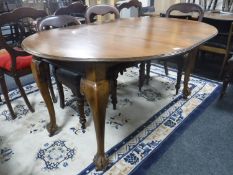 A Victorian mahogany wind out dining table on claw and ball feet