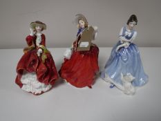 Three Royal Doulton figures; Autumn Breeze HN 1934,