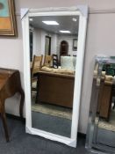 A cream ornate mirror,