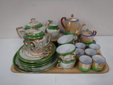 A tray containing two Oriental tea services