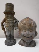 A cast metal Smiling Sam money box together with a cast metal Mr.