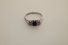 An 18ct gold sapphire and diamond ring
