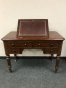 A Victorian mahogany writing table,