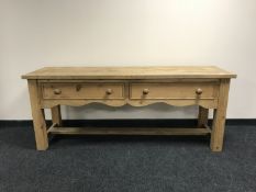 A reclaimed pine kitchen preparation table,