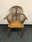 An antique elm Windsor armchair