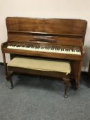 A walnut cased overstrung piano by Squire & Longson,