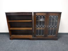 A set of oak open bookshelves together with an oak double door bookcase