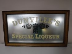 A framed mirror with advertising decoration ' Dunville's Special Liqueur'
