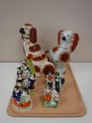 A tray containing two Staffordshire dogs, Staffordshire spill vase,