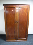 A late Victorian mahogany double door gentleman's wardrobe