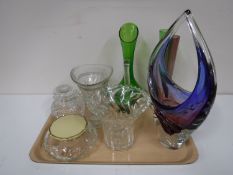 A tray containing pressed and cut glass,