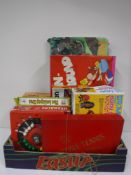 A box containing vintage games, including Tom and Jerry run around,