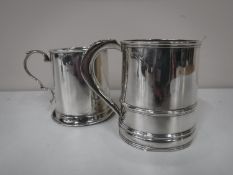 Two silver tankards,