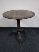 A Victorian oak pedestal occasional table