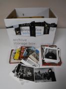 A box containing a large quantity of postcards,