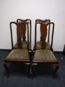 A set of four mahogany Queen Anne style dining chairs