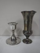 A loaded silver trumpet vase together with a loaded silver dwarf candlestick