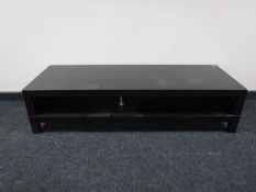 A contemporary Ikea two tier entertainment stand in black ash finish