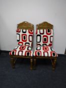 A pair of colonial style dining chairs