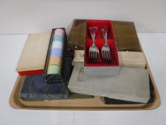 A tray containing boxed table cutlery,