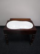 A Victorian mahogany child's bath table with liner
