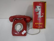 A vintage British Telecom red plastic telephone together with a boxed Spong mincer