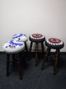 A set of four contemporary upholstered bar stools