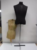 A Dress makers dummy on stand,