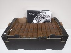 A box containing twelve volumes of Harmsworths Encyclopaedia,