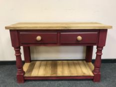 A reclaimed pine two drawer kitchen prep table on painted base