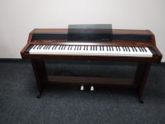 A Roland electric Piano Plus 450 piano