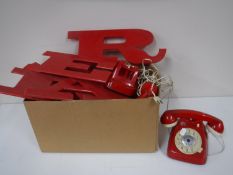 A box containing two mid twentieth century children's Canova telephones,