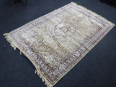 A machine made rug of Isfahan design,