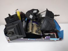 A box containing outdoor carriage lamps, Ipad cases,