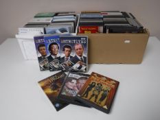 Four boxes containing assorted DVD's and box sets