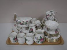 Approximately eighty-four pieces of Wedgwood Charnwood tea and dinnerware