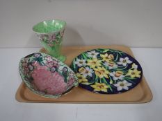 A Maling lustre wall plaque, depicting daffodils,