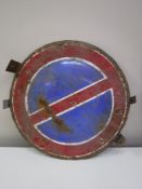A circular enamelled road sign
