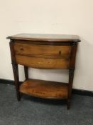 A reproduction marble topped two drawer side,