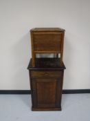 An oak cabinet and a commode stool