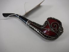 A twentieth century pipe with filigree metal work decoration