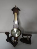 A contemporary barometer together with a cobbler's last and a flat iron